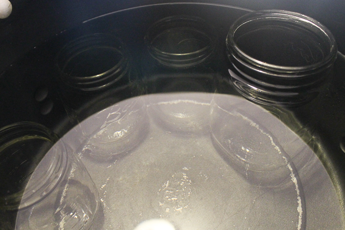 mason jars in pot of water