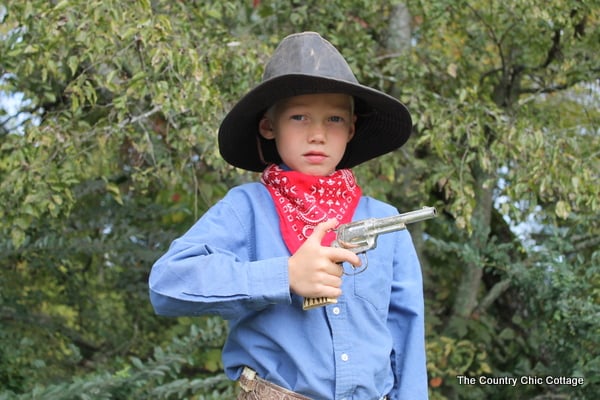 This cowboy halloween costume was put together with thrift store finds