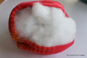 stuffing a pumpkin with cotton filling