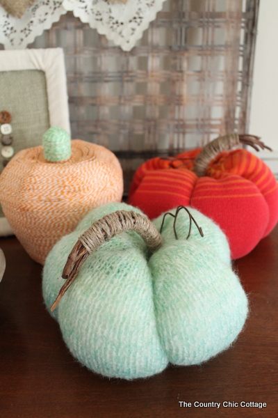 DIY Sweater Pumpkins three fabric pumpkins on table