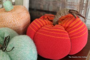 two blue and orange sweater pumpkins