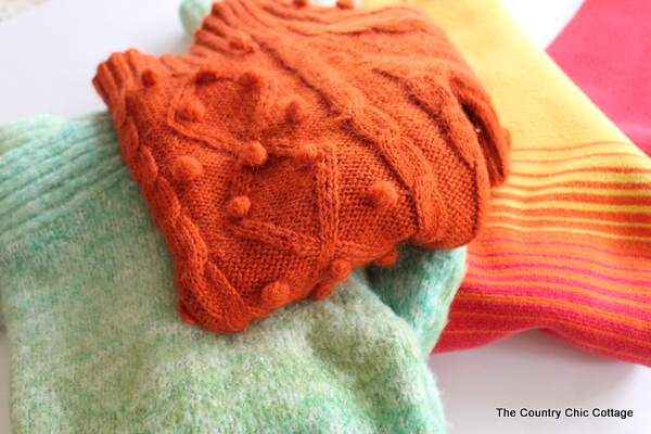 DIY Sweater Pumpkins sweaters in a pile