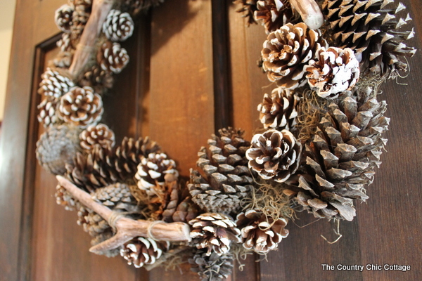faux antler wreath from the pottery barn faux antler wreath wine pine cones and Spanish moss
