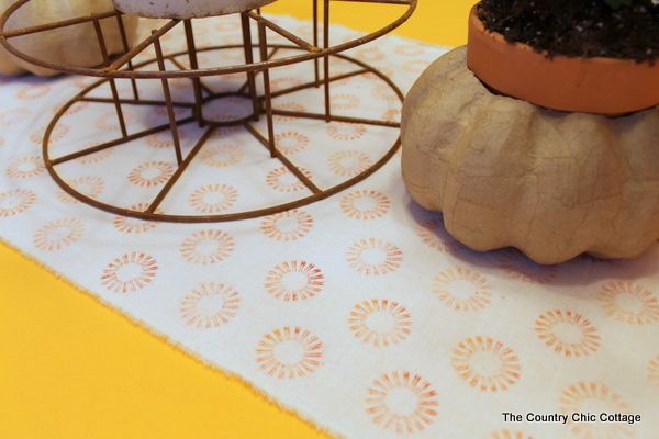 stamped table runner on yellow table