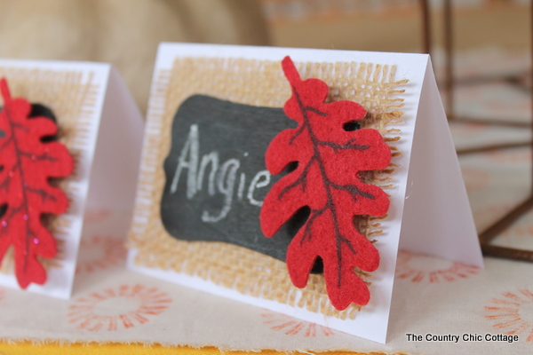 close up at an angle of Thanksgiving placecard with fall leaf on it