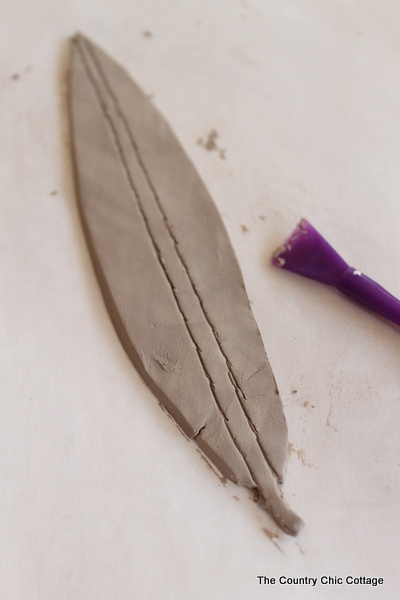 drawing feather stem in clay