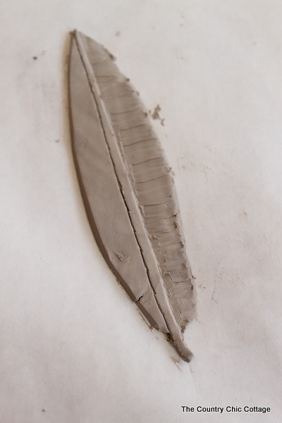 drawing a feather in clay