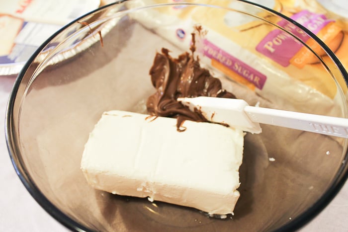 Mixing cream cheese and Nutella in a bowl