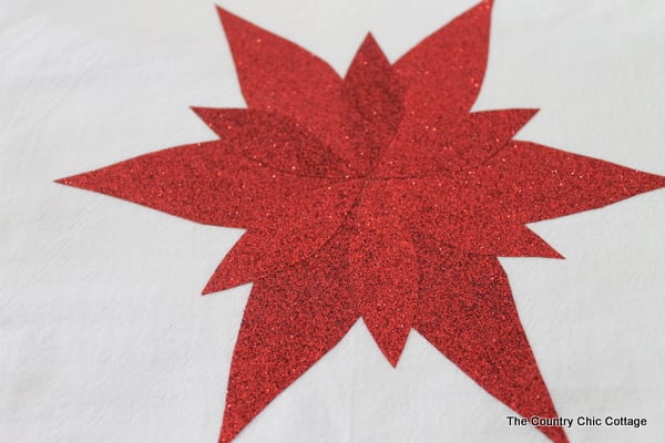 creating a poinsettia with red glitter paper