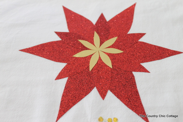 creating poinsettia with gold and red paper