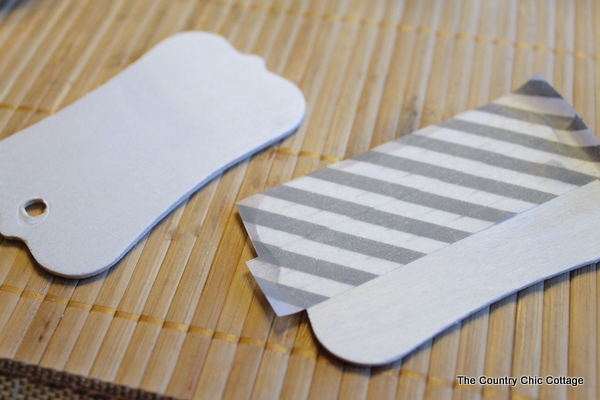 Covering wooden gift tags with striped tape