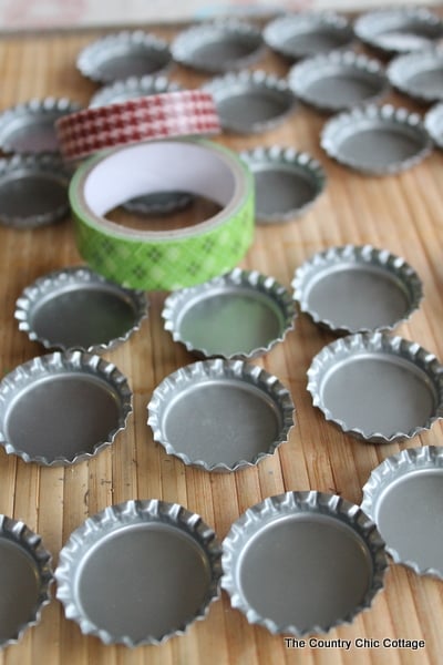 bottle caps with rolls of washi tape