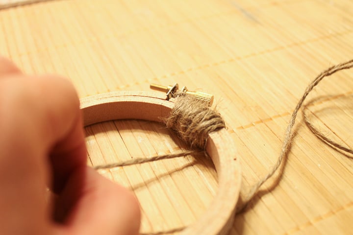 wrapping twine around an embroidery hoop