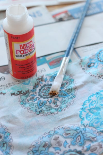 mod podge and paint brush to make fabric art