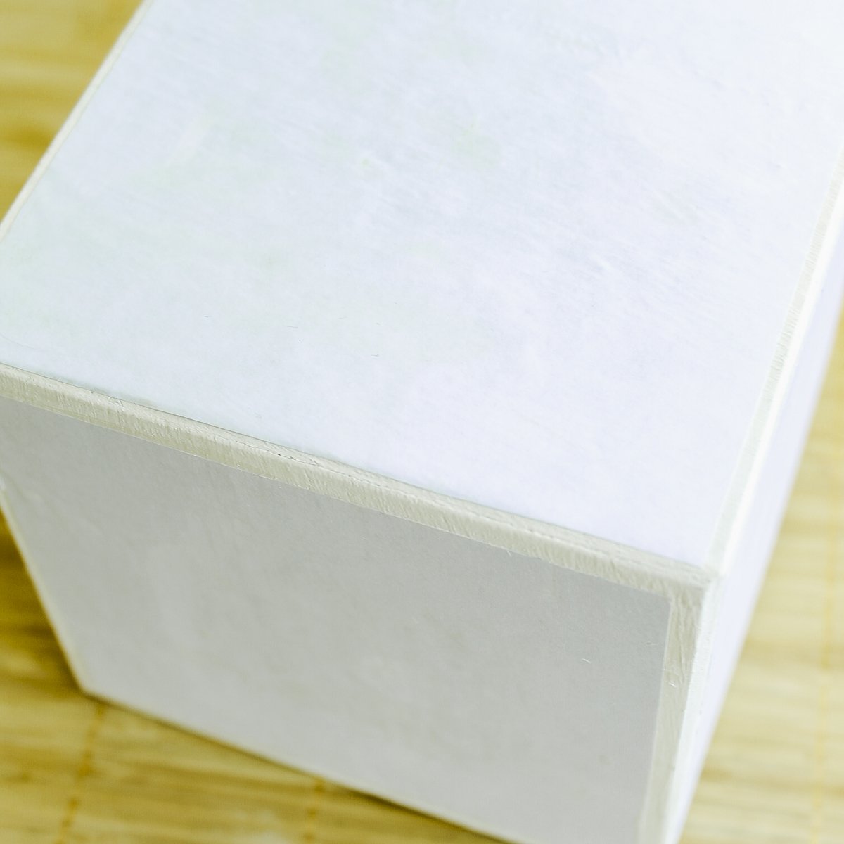 photos that have been adding with mod podge to a wood cube