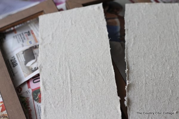 canvas material pieces cut to fit inside frames