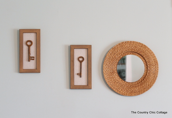 DIY key shadow boxes hanging on wall with mirror