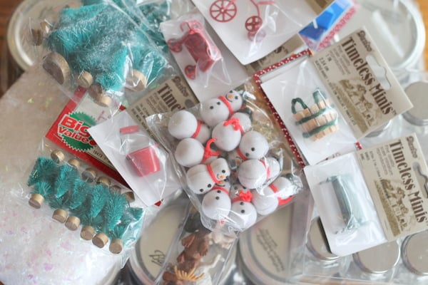 DIY Waterless Snow Globes with Kids A bunch of bags of miniatures.