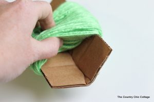 Cardboard with yarn