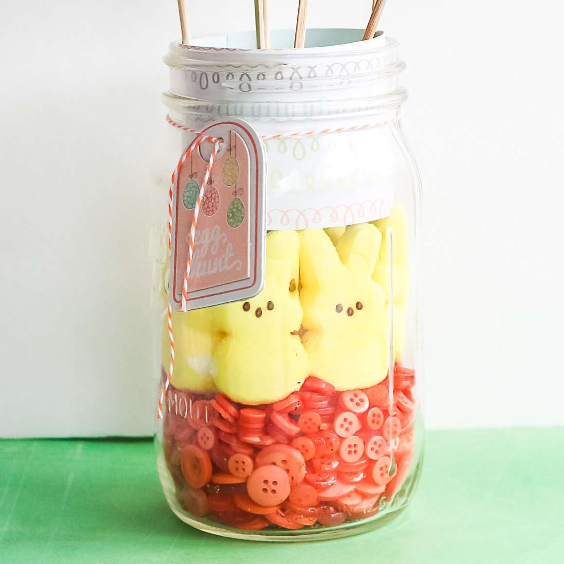 peeps and buttons in a glass jar