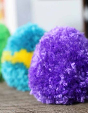 Purple, blue, and green pom pom eggs.