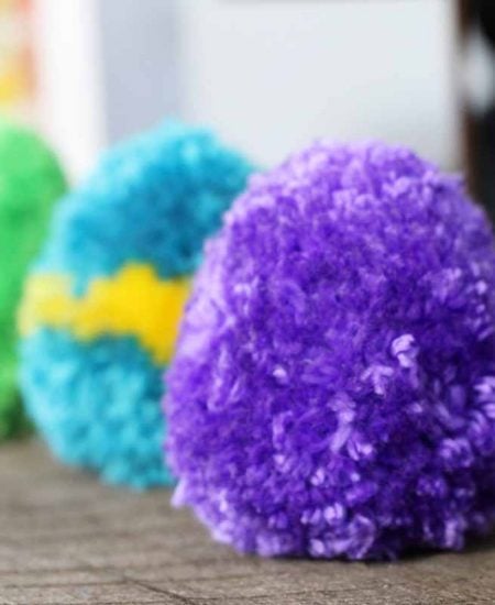 Purple, blue, and green pom pom eggs.