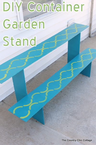 DIY Container Garden Stand that is perfect for a deck or porch. Gorgeous stenciled details! Click for the plans for build.