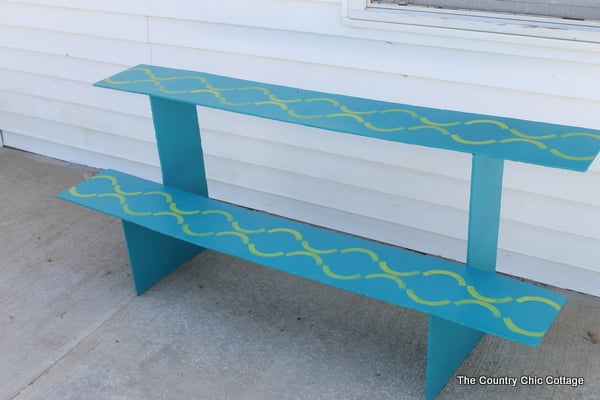 DIY Container Garden Stand that is perfect for a deck or porch. Gorgeous stenciled details! Click for the plans for build.