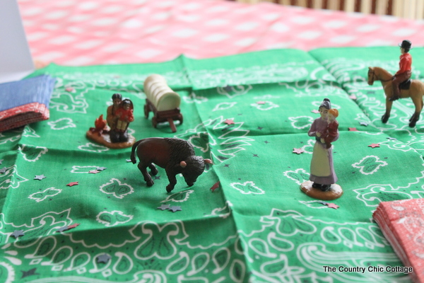 Some cute little figurines make this cowboy theme birthday party even cooler!