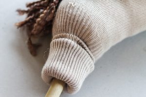 folding sock to add to a dowel rod