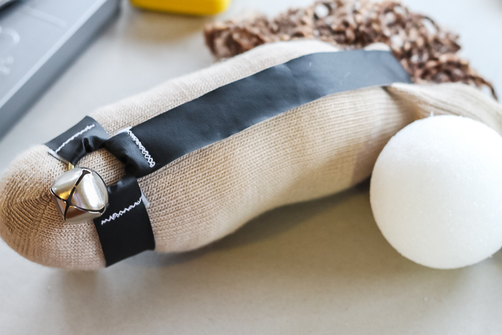 adding a styrofoam ball to a sock