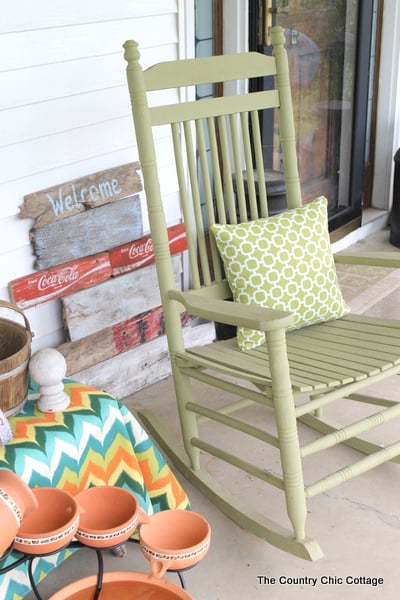 A colorful front porch transformation with a great solar powered fountain -- a must see!