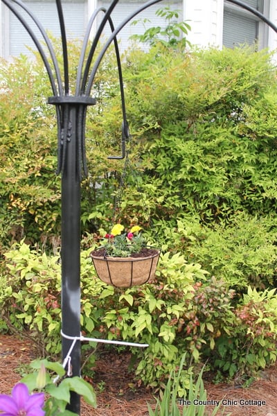 Turn old farm equipment into a way to hang your flowering baskets this summer! A great project for any yard. Plus enter to win a $25 gift card!