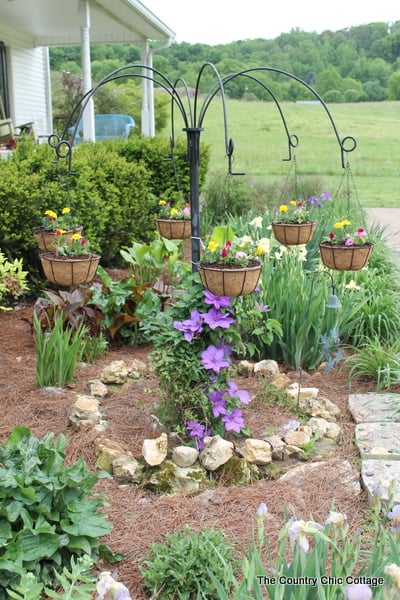 Turn old farm equipment into a way to hang your flowering baskets this summer! A great project for any yard. Plus enter to win a $25 gift card!