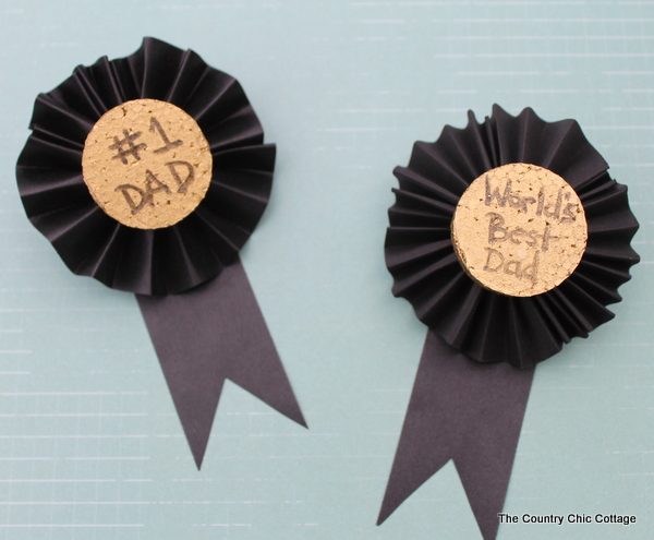 These Father's Day medals are a great craft for kids to help make for Dad. Turn the kids loose on the painting and text while you fold the ribbon and add a pin. Dad will be proud to wear these medals on his big day!