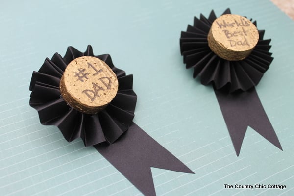 These Father's Day medals are a great craft for kids to help make for Dad. Turn the kids loose on the painting and text while you fold the ribbon and add a pin. Dad will be proud to wear these medals on his big day!