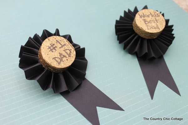 These Father's Day medals are a great craft for kids to help make for Dad. Turn the kids loose on the painting and text while you fold the ribbon and add a pin. Dad will be proud to wear these medals on his big day!These Father's Day medals are a great craft for kids to help make for Dad. Turn the kids loose on the painting and text while you fold the ribbon and add a pin. Dad will be proud to wear these medals on his big day! These Father's Day medals are a great craft for kids to help make for Dad. Turn the kids loose on the painting and text while you fold the ribbon and add a pin. Dad will be proud to wear these medals on his big day!