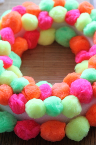 Neon Pompom Wreath -- make your front door shine this summer with a touch of these bright pompoms!