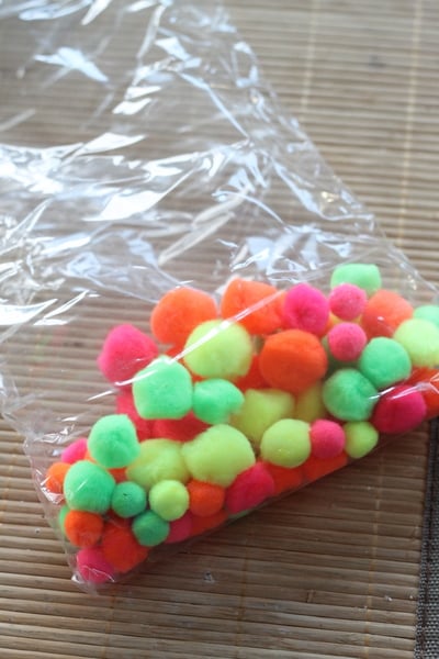 Neon Pompom Wreath -- make your front door shine this summer with a touch of these bright pompoms! Neon Pompom Wreath -- make your front door shine this summer with a touch of these bright pompoms!