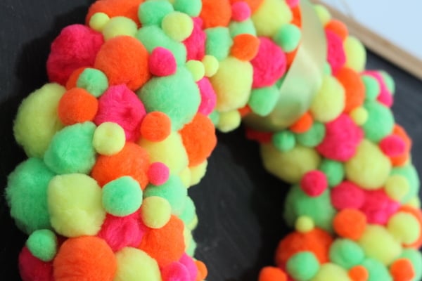 Neon Pompom Wreath -- make your front door shine this summer with a touch of these bright pompoms!