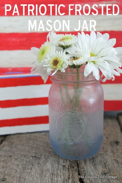 Make frosted glass mason jars in a variety of themes. This patriotic mason jar is just one idea in this post about painting glass mason jars.