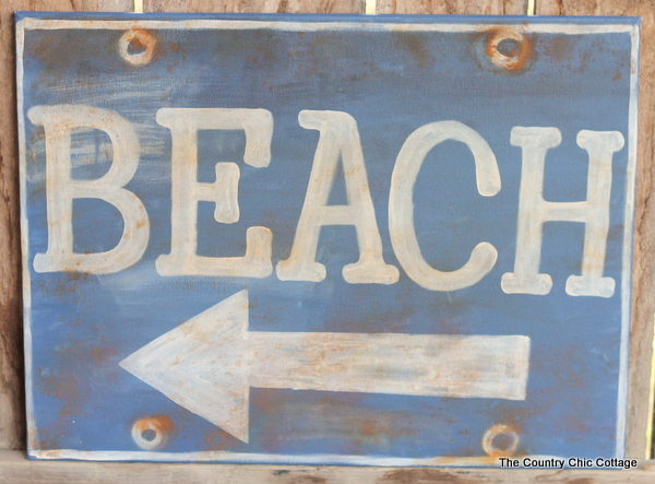 Ballard Designs Knock Off Beach Sign -- a great technique for getting a rusty appearance on a painted sign easily. You probably already have the secret ingredient in your kitchen! Ballard Designs Knock Off Beach Sign