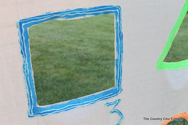 Glow in the Dark Yard Game -- make a summer of fun memories by adding yard games to your backyard or party. This glow in the dark game does not have to stop when the sun goes down! backyard game outside