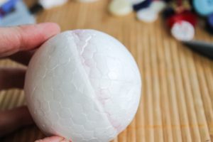 cutting a styrofoam ball