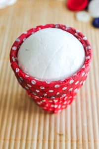 putting a styrofoam ball in a terracotta pot