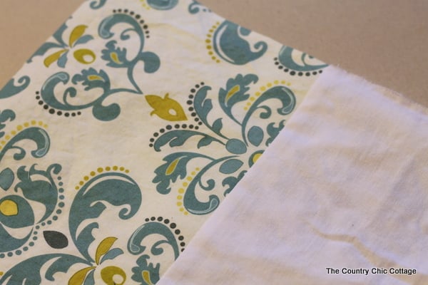 The excess fabric at the end of your curtain is ironed flat and now your sides are ready to be sewn