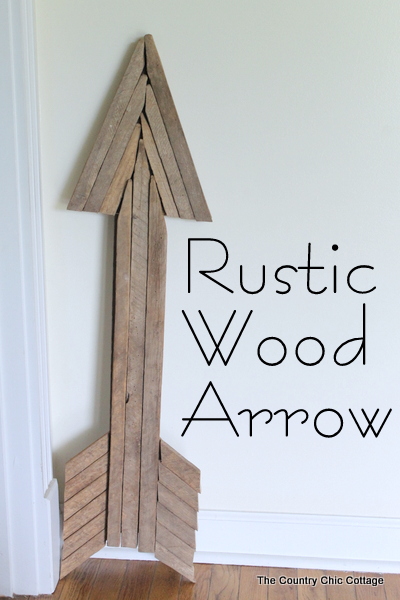 Use reclaimed wood sticks to make this extra large rustic wood arrow for your home today.