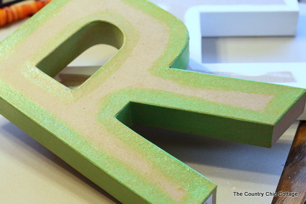 Still Life Monogram -- a copycat of the Anthropologie original but for a fraction of the price. If you love that Anthro look in your home you will want to check out this great DIY tutorial on how to make you own still life monograms. painted monogram letter r