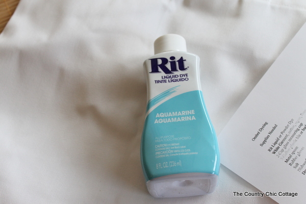 A bottle of aquamarine Rit Liquid Dye. 