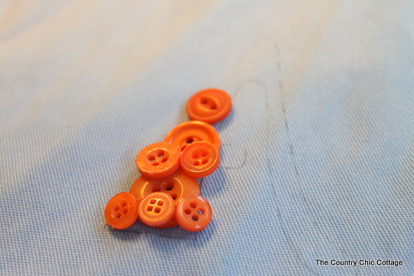 Monogramming a diy tote bag with buttons. 